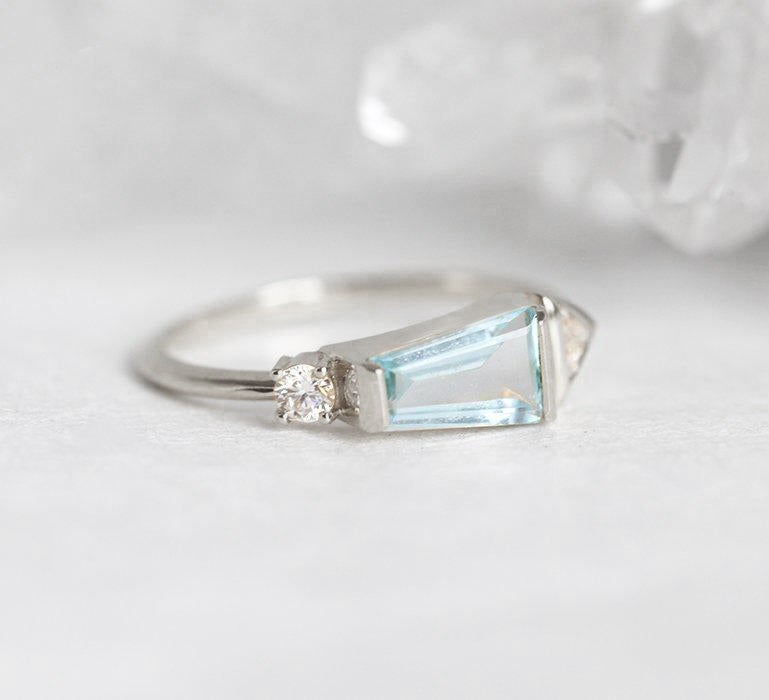 Trapezoid-Cut Light Blue Aquamarine Cluster Ring with one Triangle-Cut White Diamond and a Round White Diamond