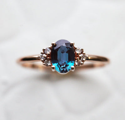 Teal Oval Alexandrite Ring Set with Nesting Band holding White Diamonds