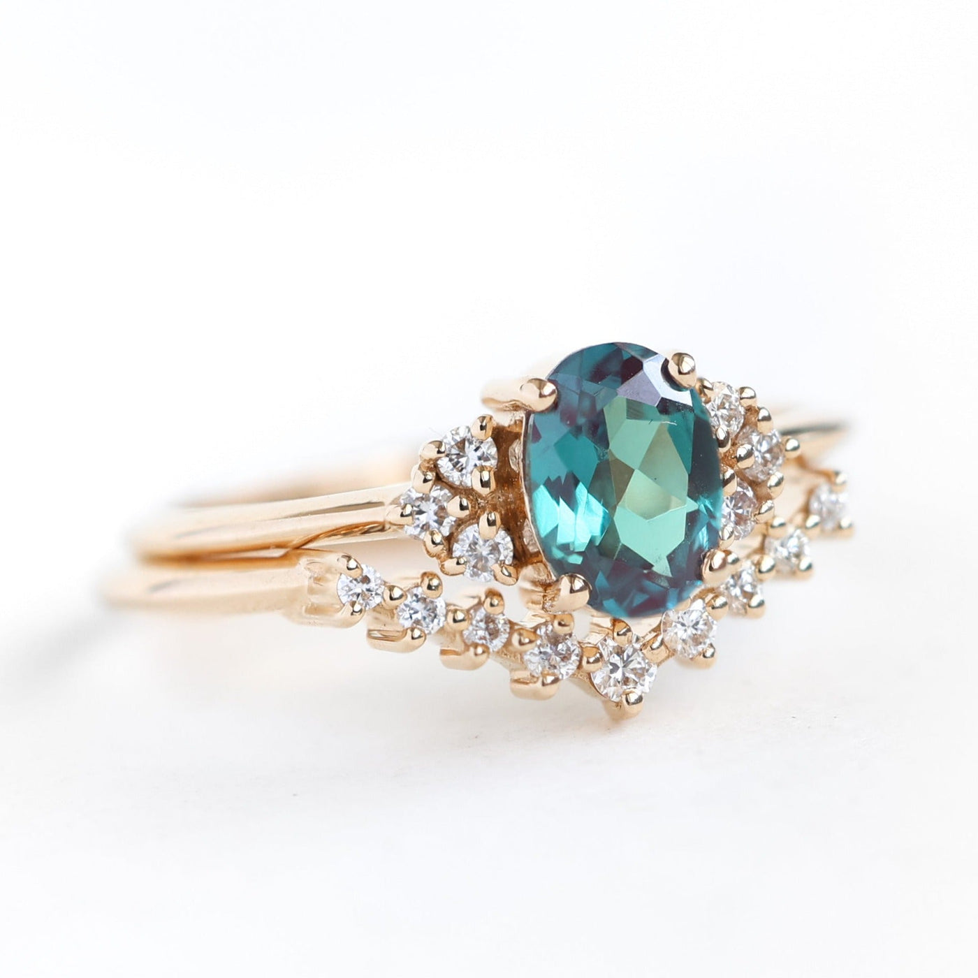 Teal Oval Alexandrite Ring Set with Nesting Band holding White Diamonds