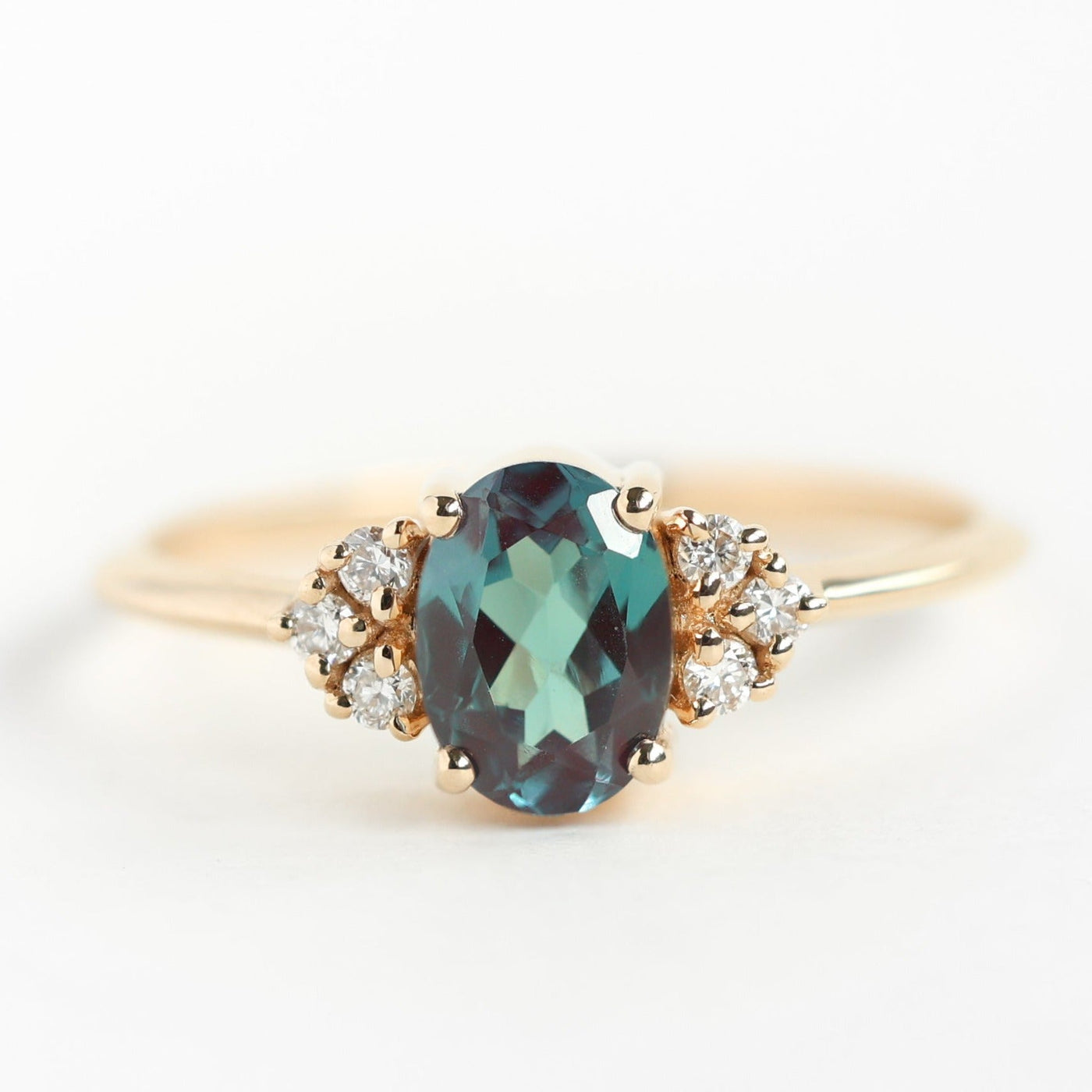 Teal Oval Alexandrite Ring Set with Nesting Band holding White Diamonds