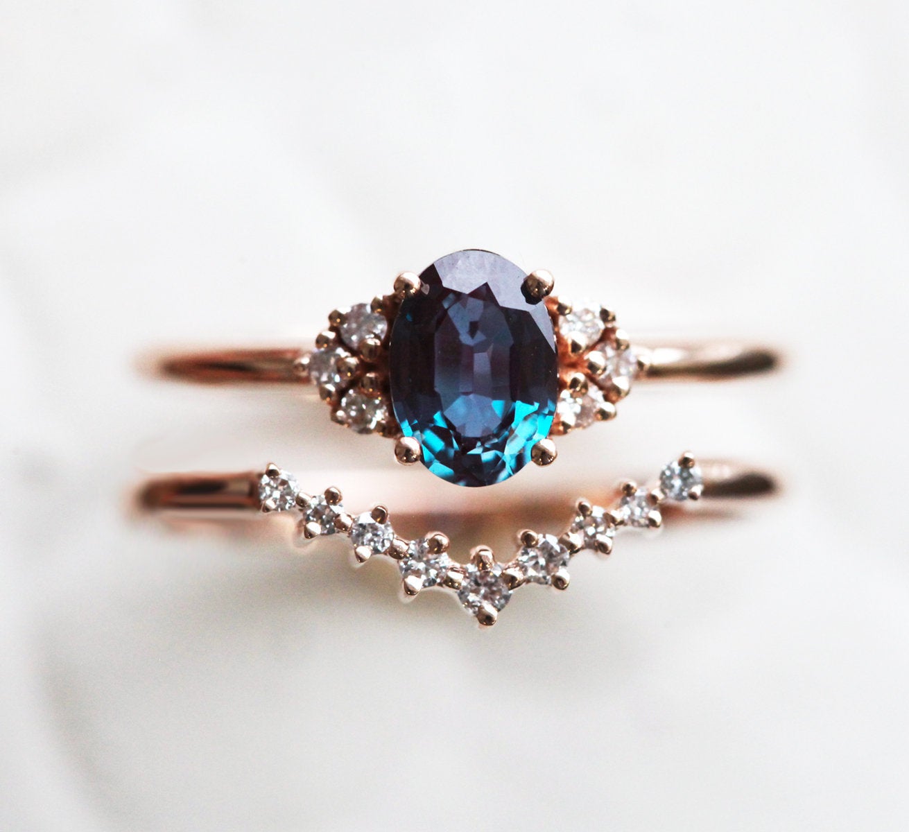 Teal Oval Alexandrite Ring Set with Nesting Band holding White Diamonds