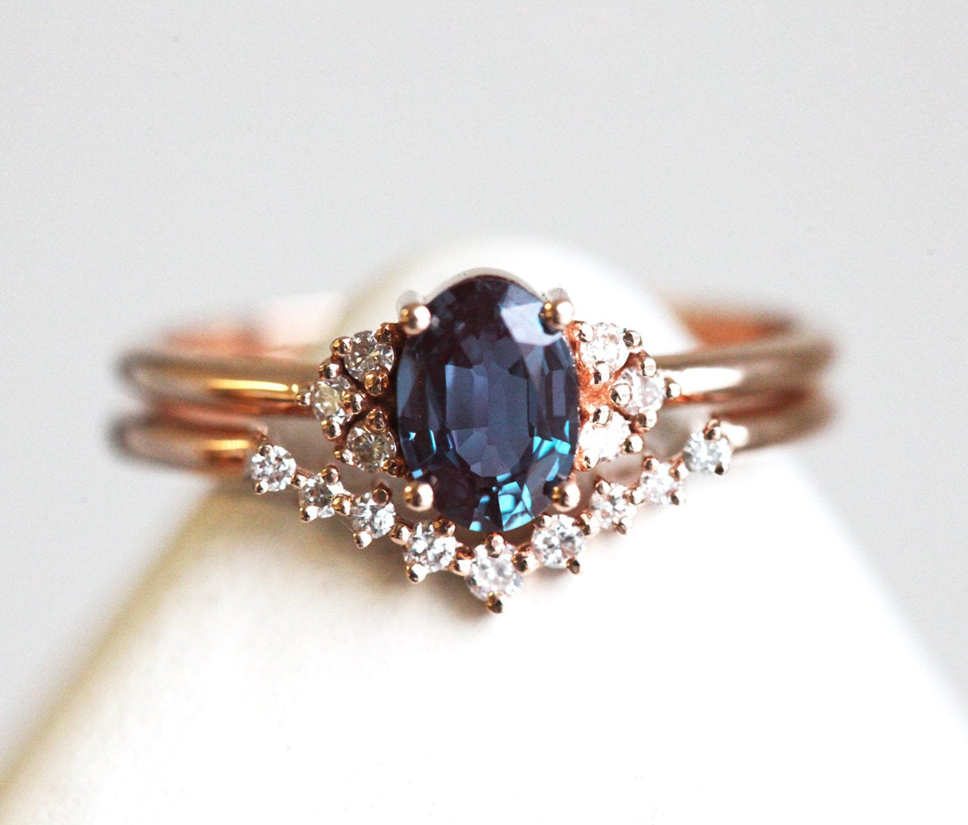 Teal Oval Alexandrite Ring with 6 Side Round White Diamonds with V-Shaped Diamond Band