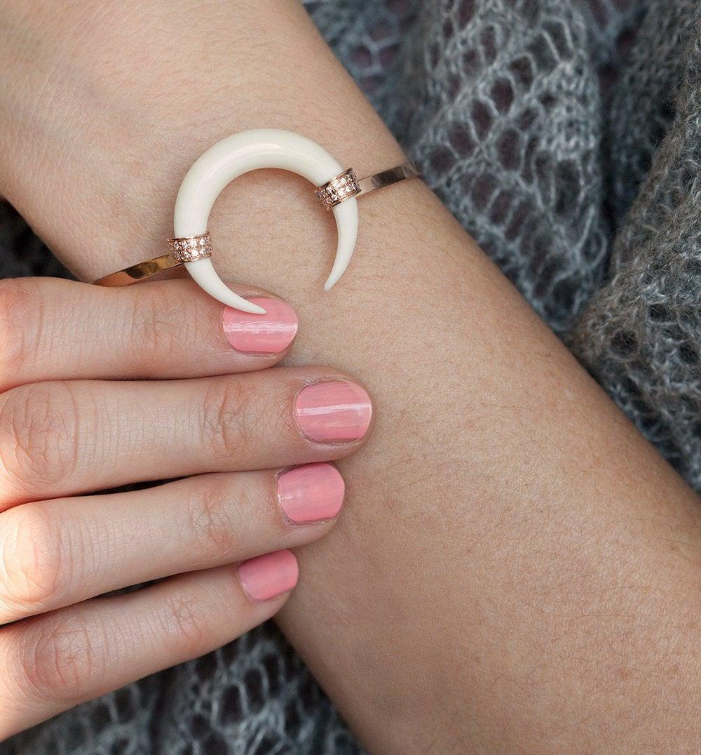 Rose gold double horn bracelet with white round diamonds