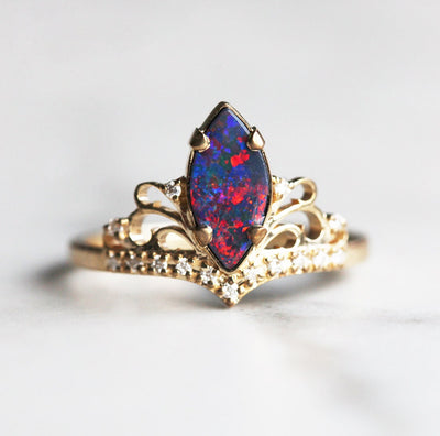 Marquise-Cut Black Opal Vintage Ring Decorated with Round White Diamonds