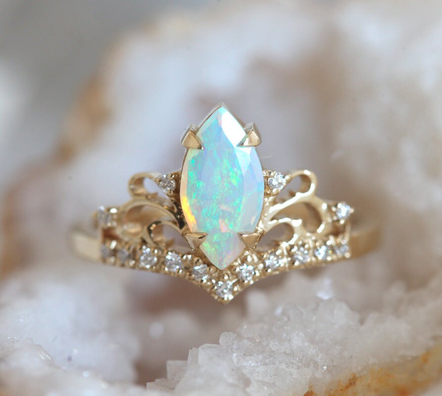 Marquise-Cut Opal Vintage Ring Decorated with Round White Diamonds