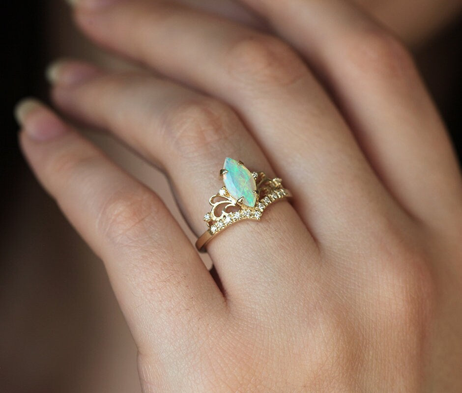 Marquise-Cut Opal Vintage Ring Decorated with Round White Diamonds