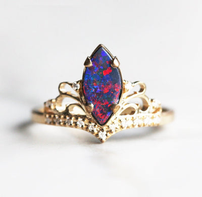 Marquise-Cut Black Opal Vintage Ring Decorated with Round White Diamonds
