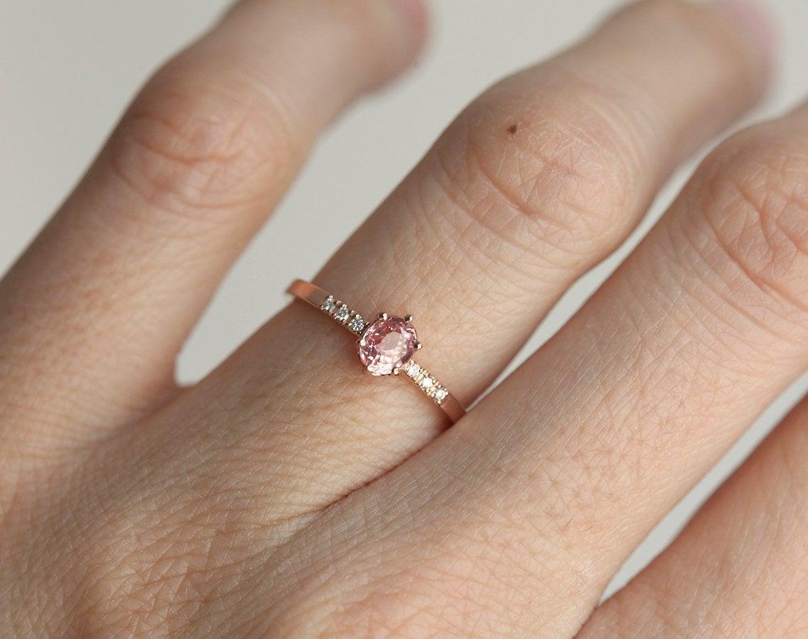 Oval peach sapphire ring with diamond pave