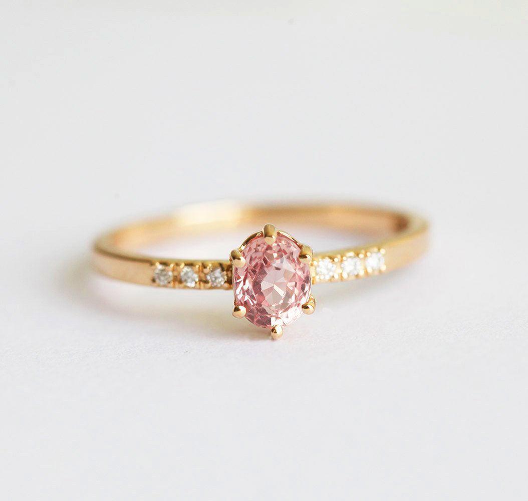 Oval peach sapphire ring with diamond pave