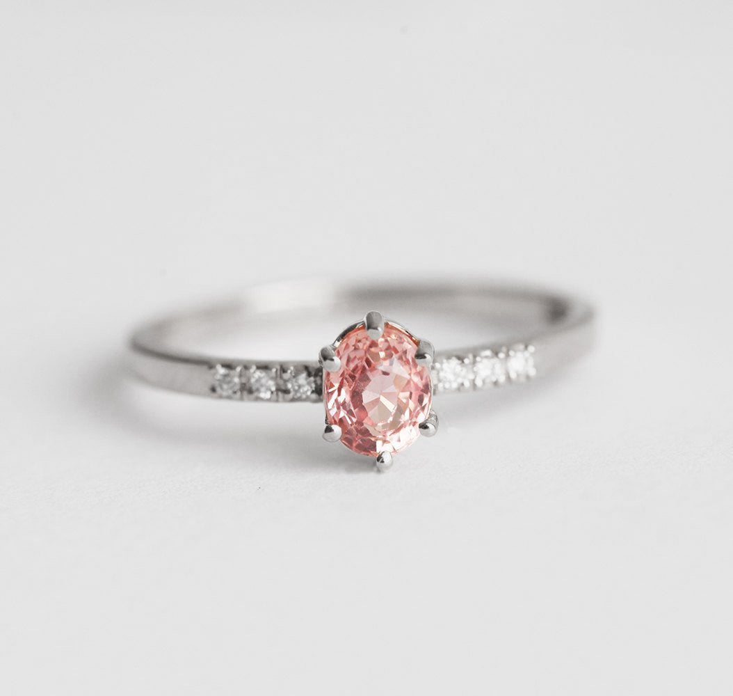 Oval peach sapphire ring with diamond pave