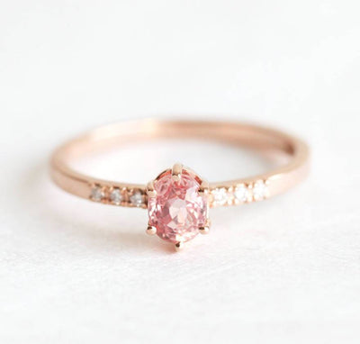 Oval peach sapphire ring with diamond pave