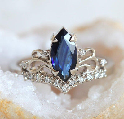 Vintage blue marquise-cut sapphire with side diamonds