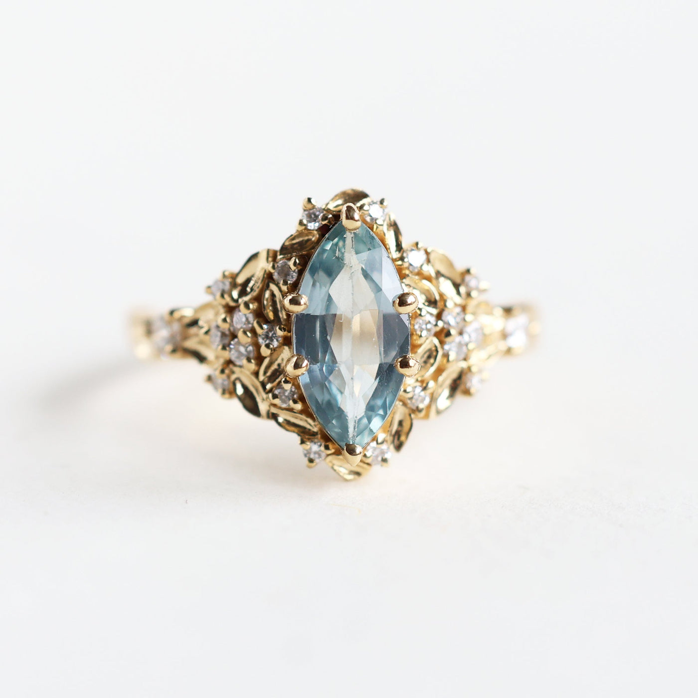 Elara marquise aqua sapphire ring with leaf detail and diamonds