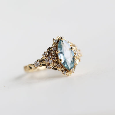 Elara marquise aqua sapphire ring with leaf detail and diamonds