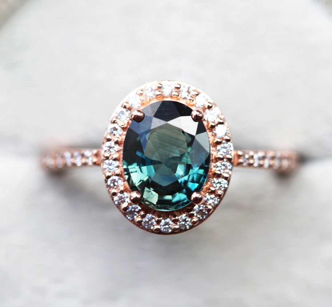 Oval blue sapphire ring with side diamonds