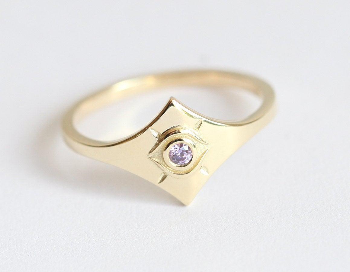 Purple Round Tanzanite Evil Eye Looking Yellow Gold Ring