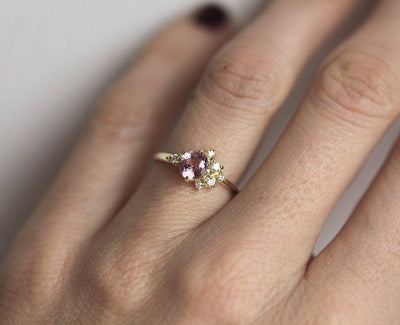 Cushion-cut pink sapphire cluster ring with diamonds