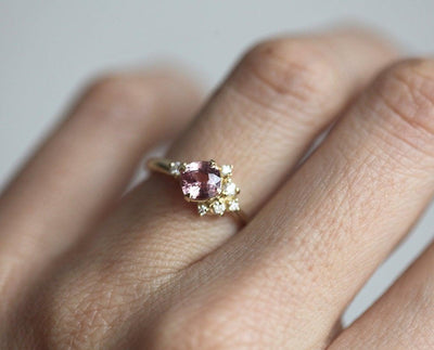 Cushion-cut pink sapphire cluster ring with diamonds