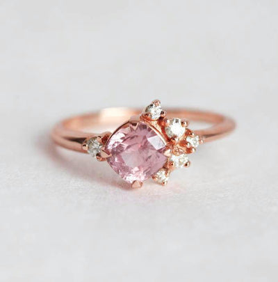 Cushion-cut pink sapphire cluster ring with diamonds