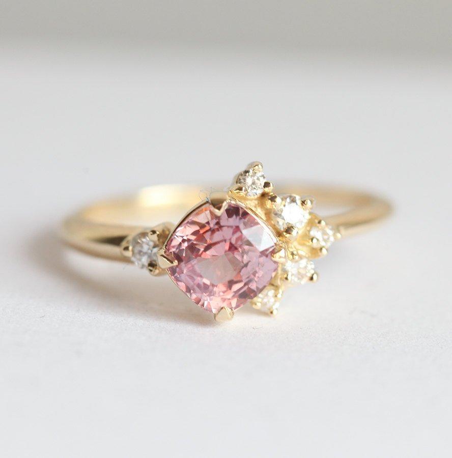 Cushion-cut pink sapphire cluster ring with diamonds