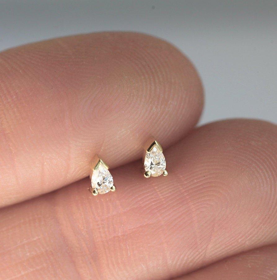 Pear-cut white diamond stud earrings