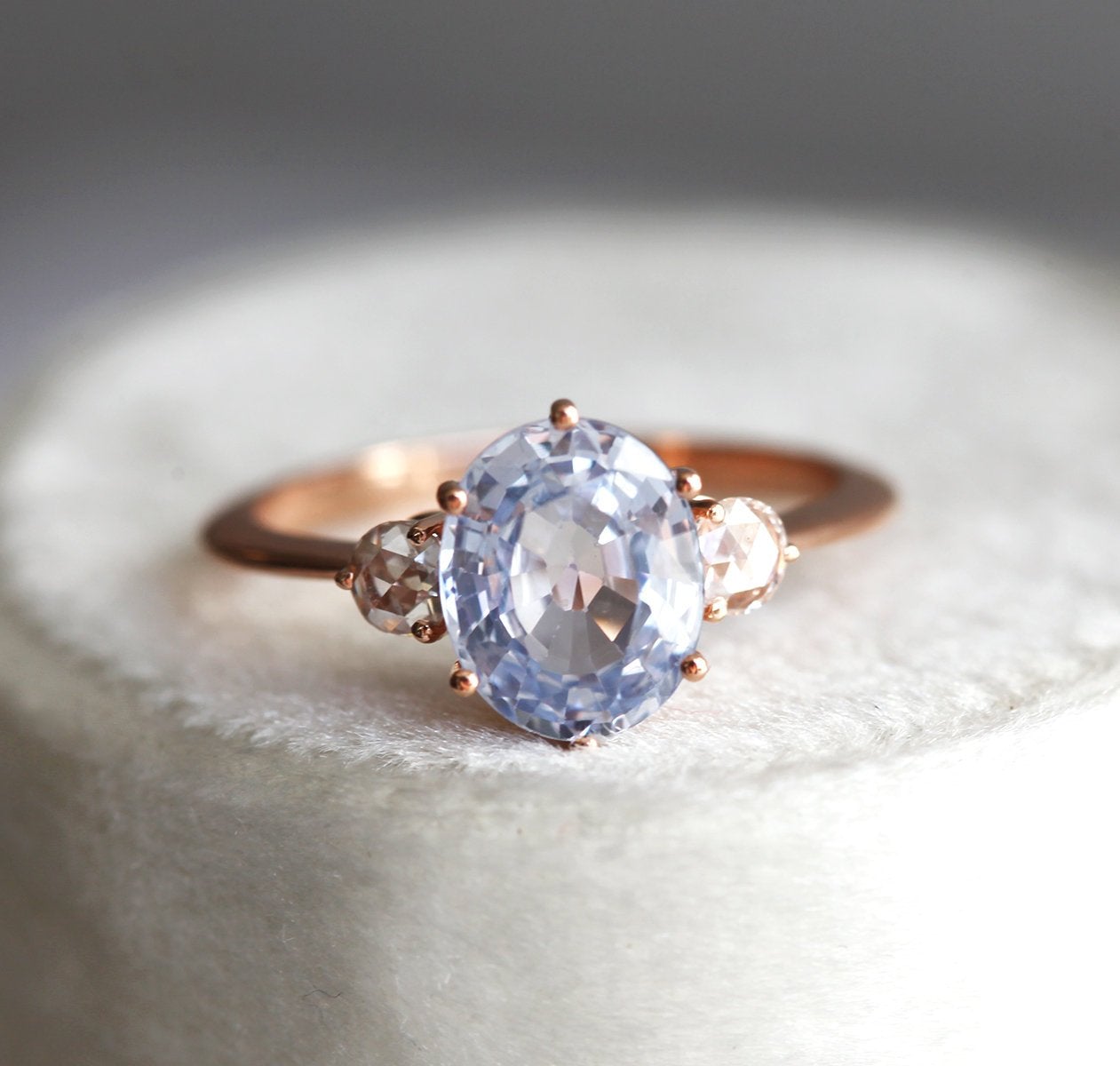 Oval sapphire ring with white side diamonds