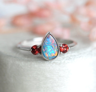 Three-Stone Black Pear Australian Opal Ring with Accent Red Round Garnet Gemstones