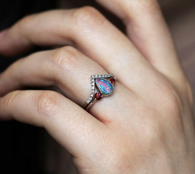 Three-Stone Black Pear Australian Opal Ring with Accent Red Round Garnet Gemstones with Diamond Crown Band