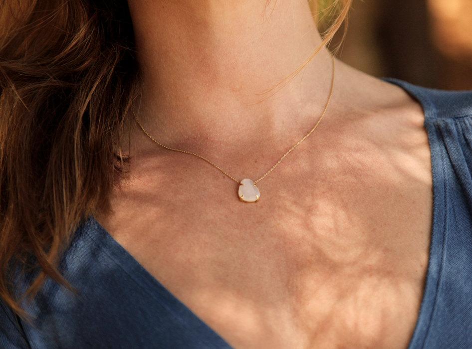 Gold necklace with white opal pendant