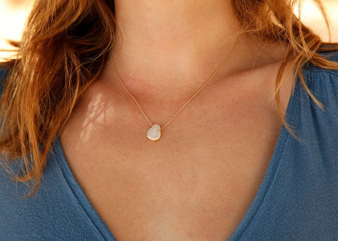 Gold necklace with white opal pendant