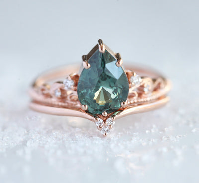 Vintage pear-shaped teal sapphire ring with white side diamonds