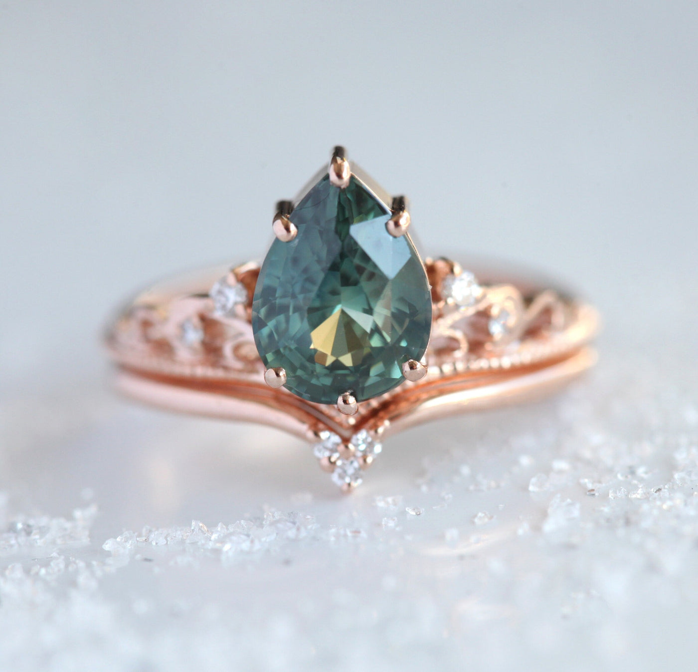Vintage pear-shaped teal sapphire ring with white side diamonds