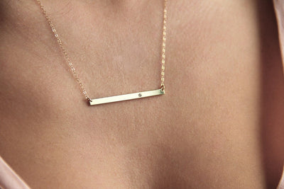 Thin Gold Bar Necklace with Round White Diamond embedded into the bar
