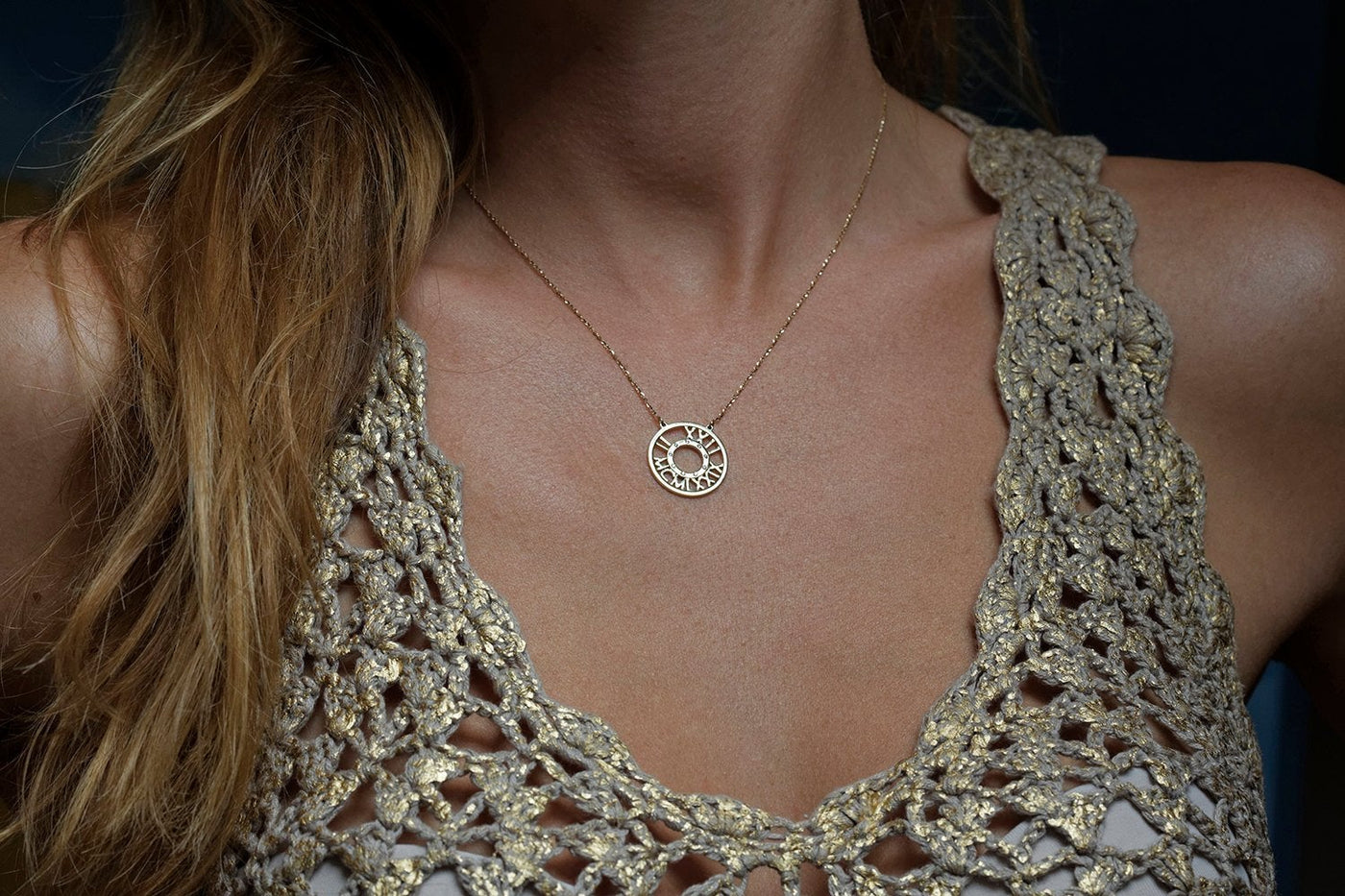 Gold necklace with roman numerals and white round diamonds