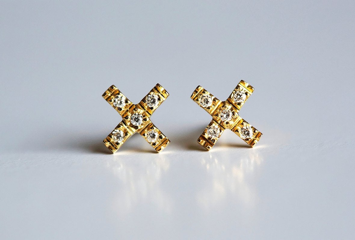 Round white diamond cross stud earrings