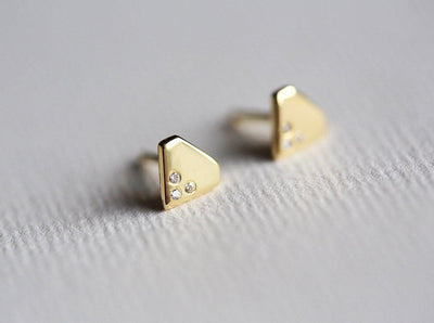 Round White Natural Diamonds set on a traditional diamond shape Gold Stud Earrings