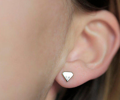 Round White Natural Diamonds set on a traditional diamond shape Gold Stud Earrings