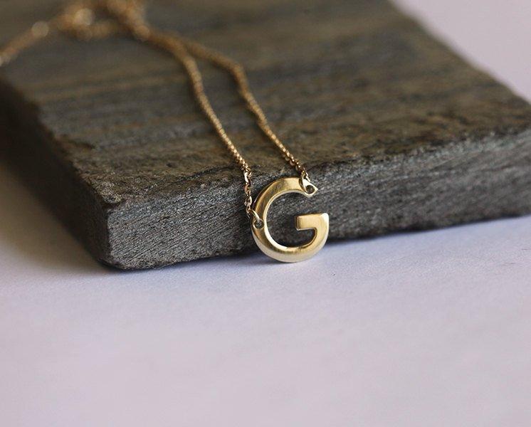 Gold necklace with initial