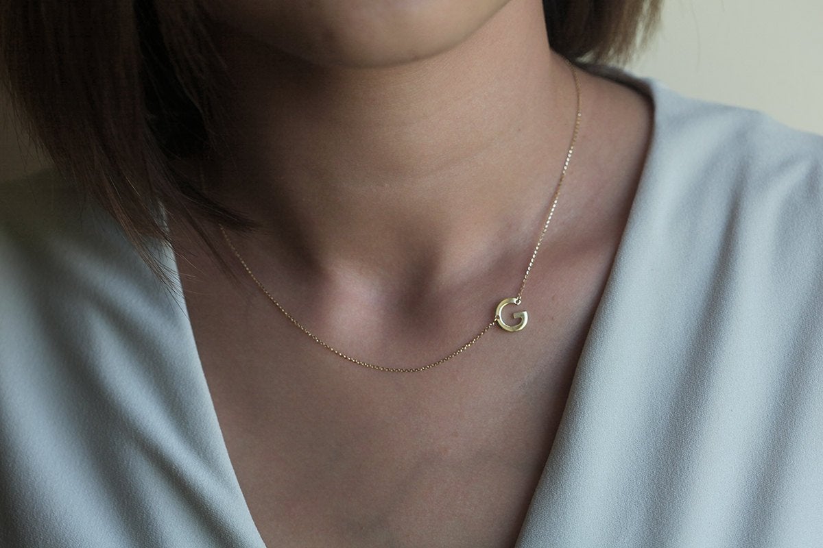 Gold necklace with initial