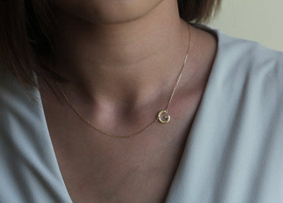 Gold necklace with initial