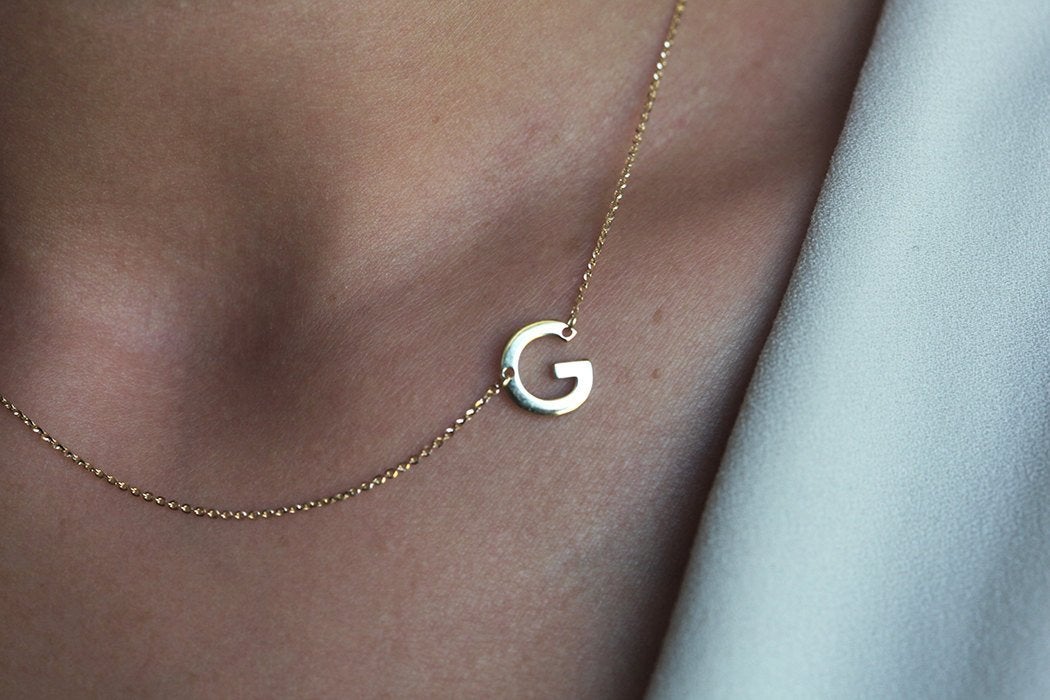 Gold necklace with initial