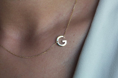 Gold necklace with initial