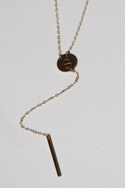 Gold lariat necklace with initial