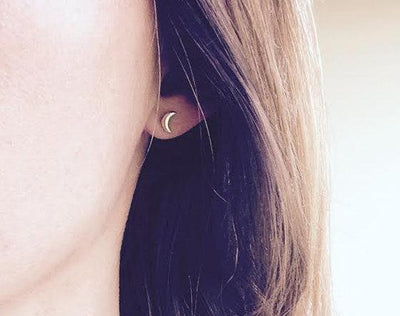 Gold crescent moon stud earrings