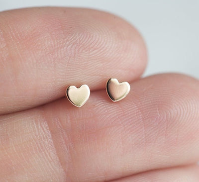 Heart shaped gold stud earrings