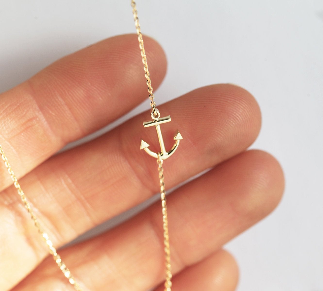 Gold sideways anchor necklace