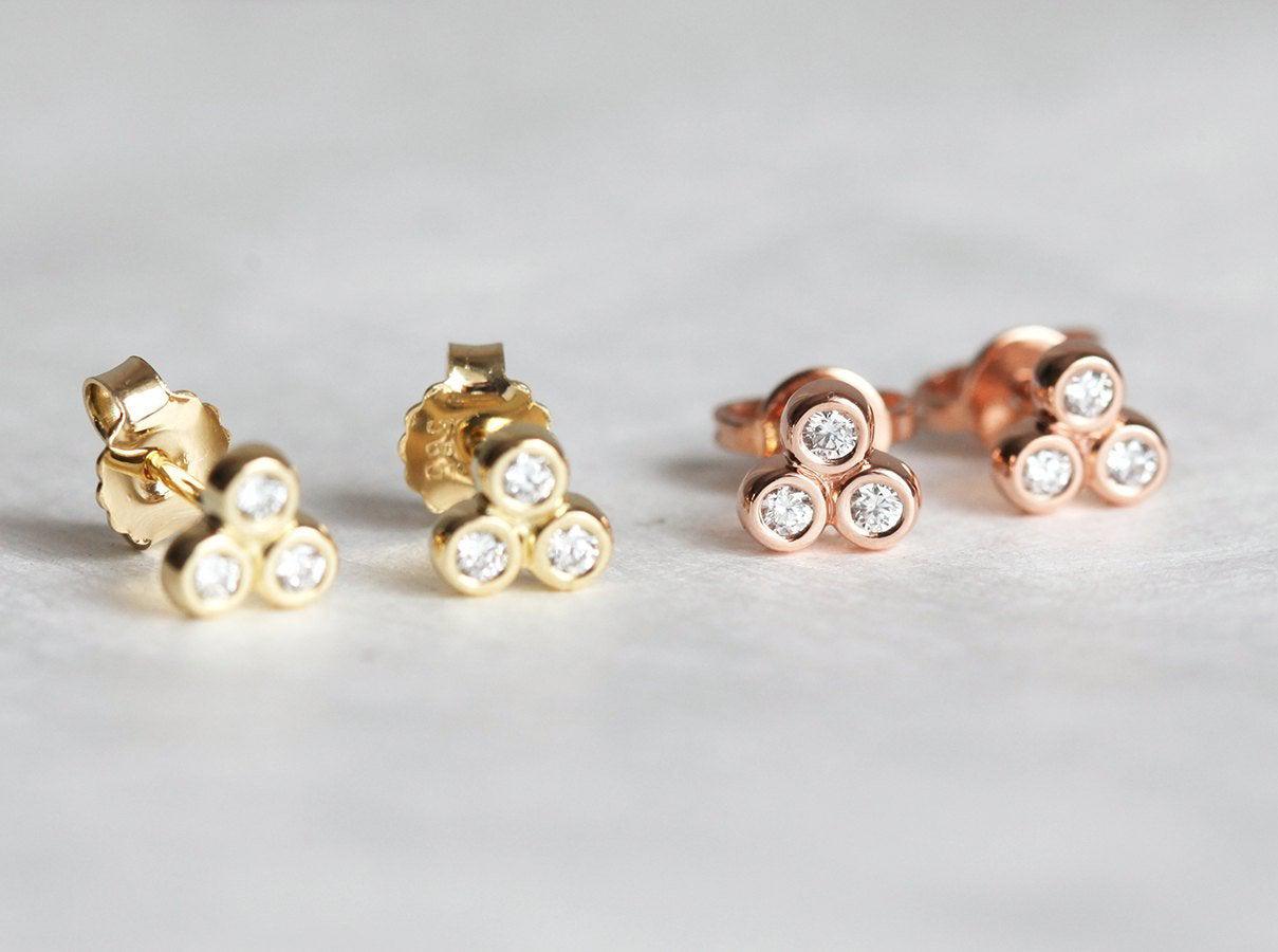 Four 3-stone round white diamonds stud gold earrings
