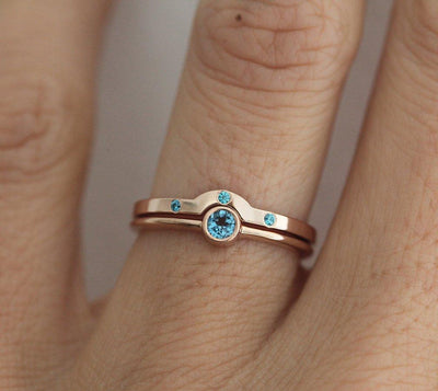 Layered round blue topaz solitaire ring set