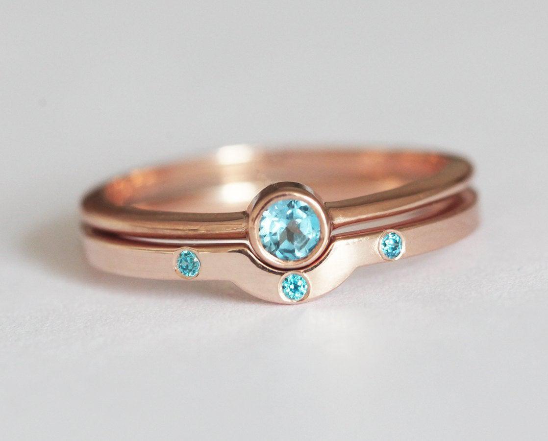 Layered round blue topaz solitaire ring set