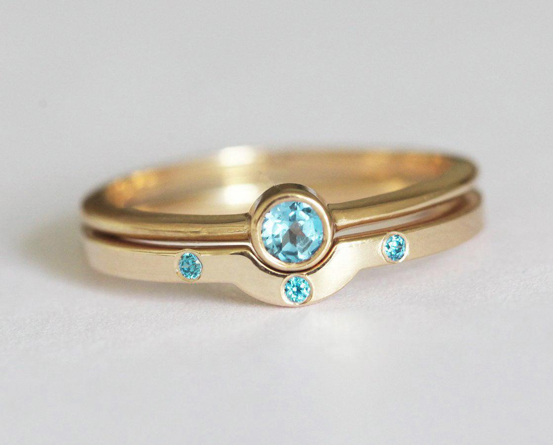 Layered round blue topaz solitaire ring set